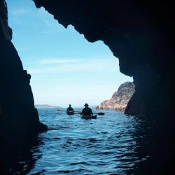 kayaks in a sea cave